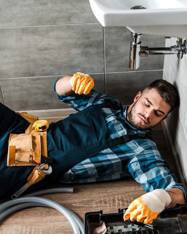 bearded-handyman-lying-on-floor-near-toolbox-in-ba-resize.jpg